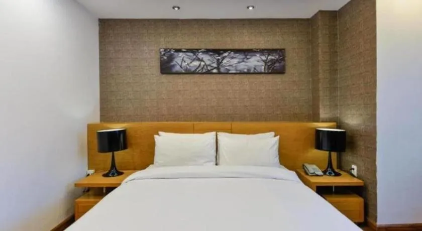 Bed in AHA Boutique Ben Thanh Hotel