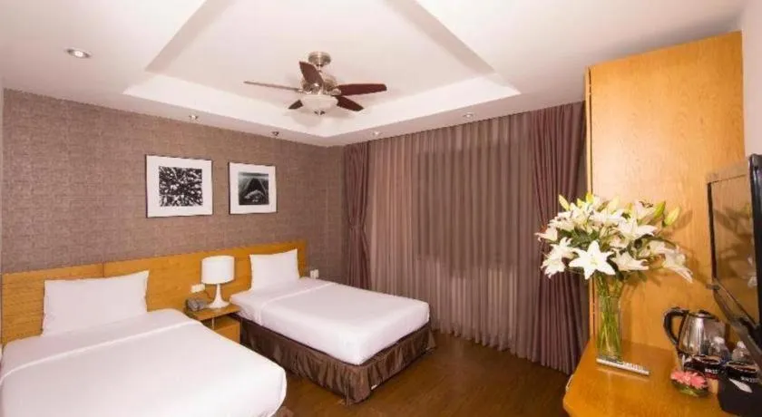 Bed in AHA Boutique Ben Thanh Hotel