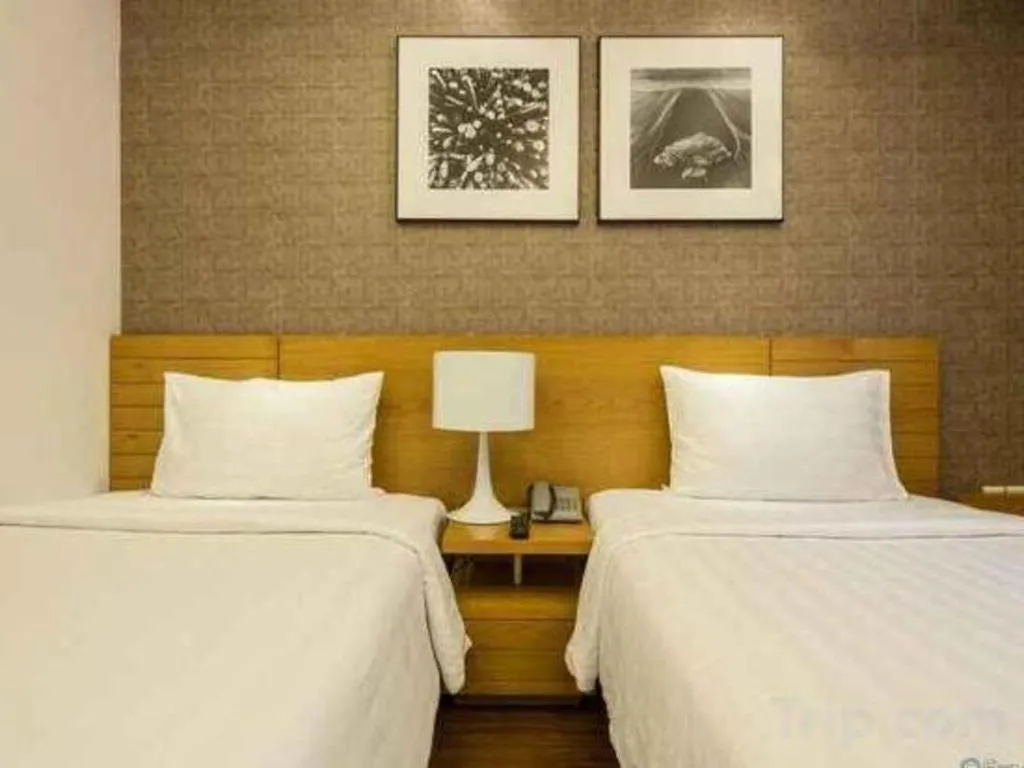 Bed in AHA Boutique Ben Thanh Hotel