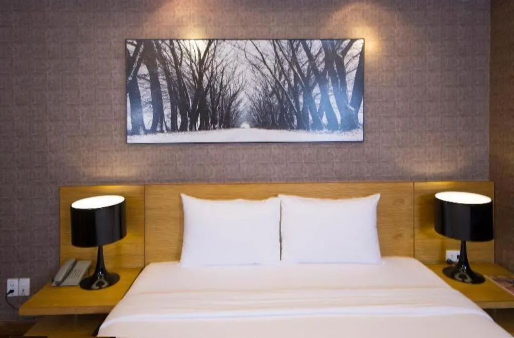 Bed in AHA Boutique Ben Thanh Hotel