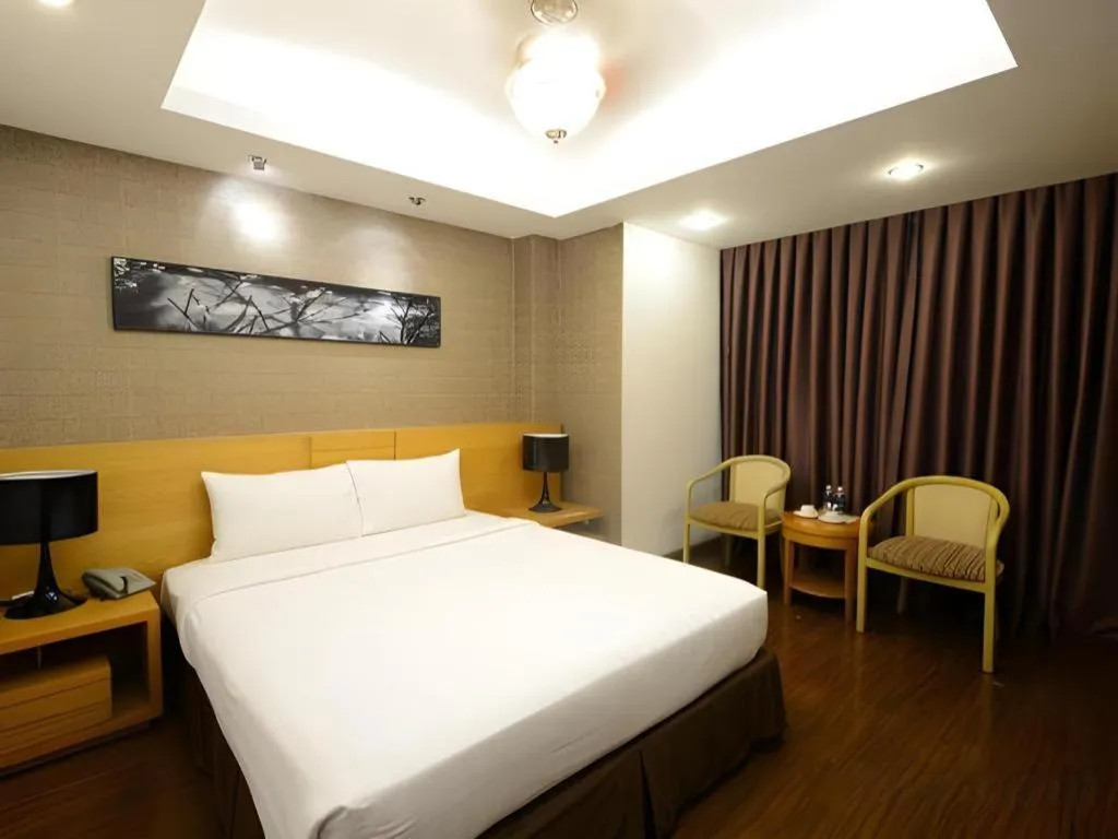Bed in AHA Boutique Ben Thanh Hotel