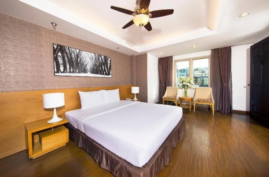 Bed in AHA Boutique Ben Thanh Hotel