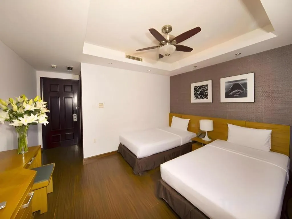 Bed in AHA Boutique Ben Thanh Hotel