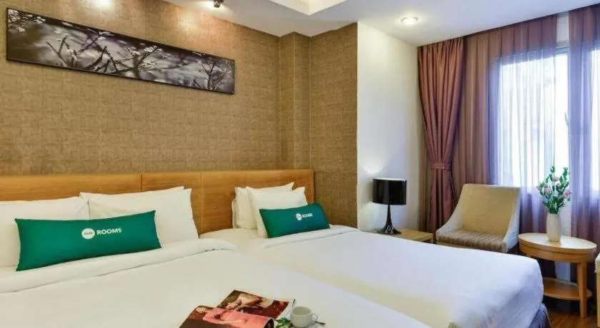 Bed in AHA Boutique Ben Thanh Hotel