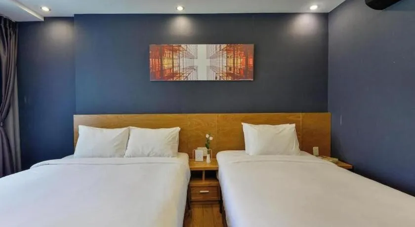 Bed in AHA Boutique Ben Thanh Hotel