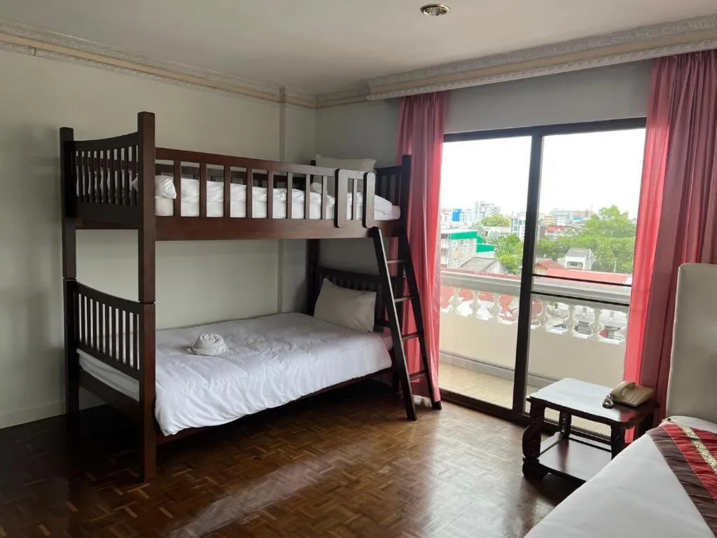 Bed in Chao Phya Grand Hotel