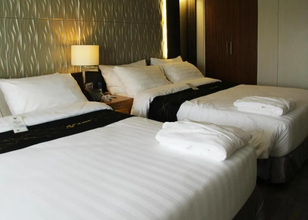 Bed in Le Monet Hotel