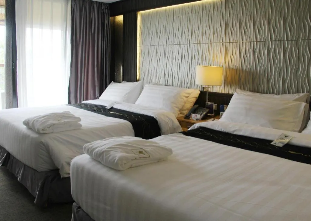 Bed in Le Monet Hotel