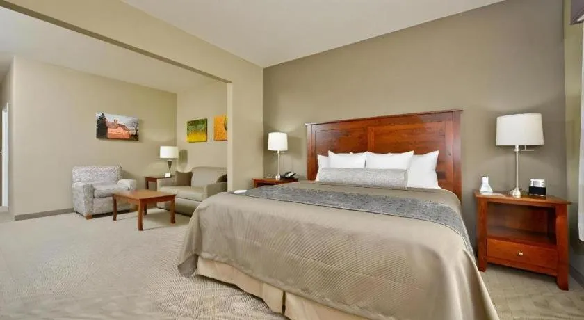 Bed in Green Mill Village Hotel & Suites, BW Signature Collection