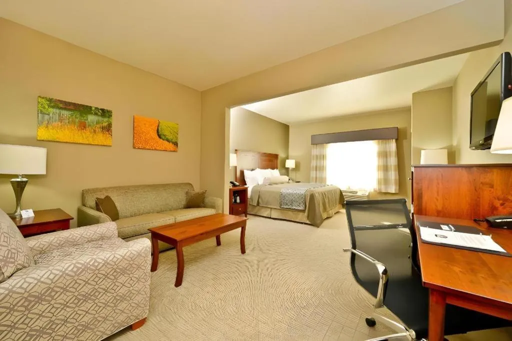 Bed in Green Mill Village Hotel & Suites, BW Signature Collection