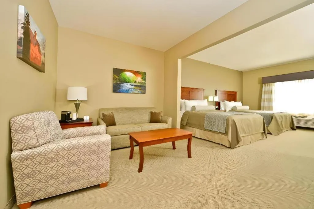 Bed in Green Mill Village Hotel & Suites, BW Signature Collection