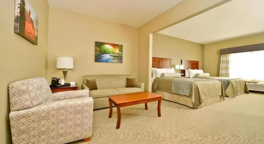Bed in Green Mill Village Hotel & Suites, BW Signature Collection
