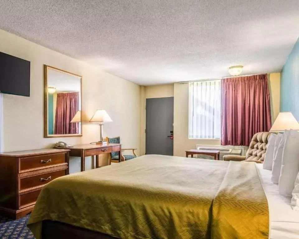 Bed in SureStay Hotel