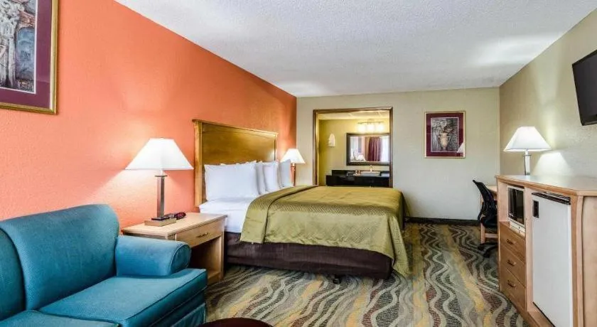 Bed in SureStay Hotel