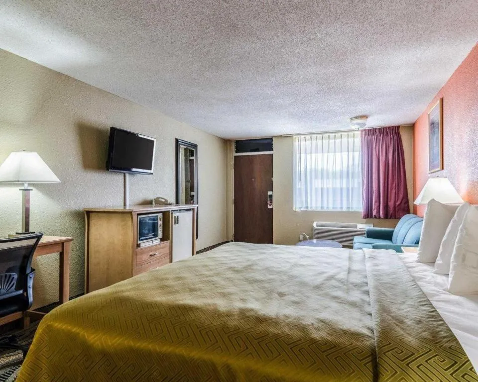 Bed in SureStay Hotel