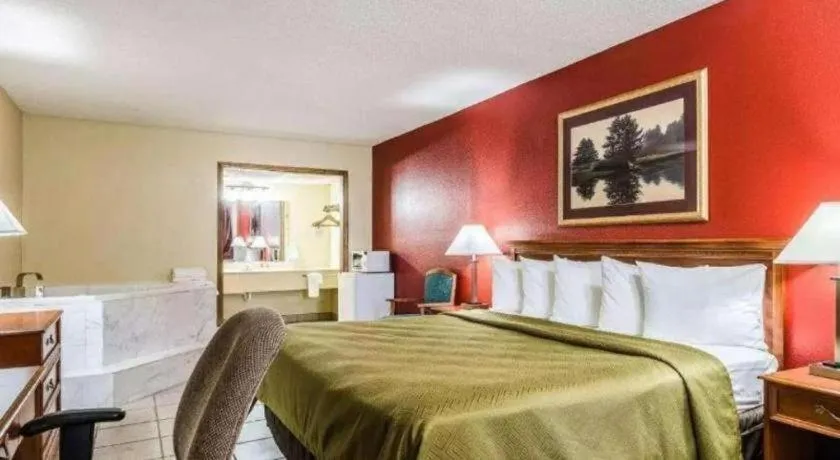 Bed in SureStay Hotel