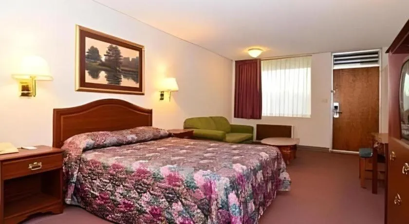 Bed in SureStay Hotel