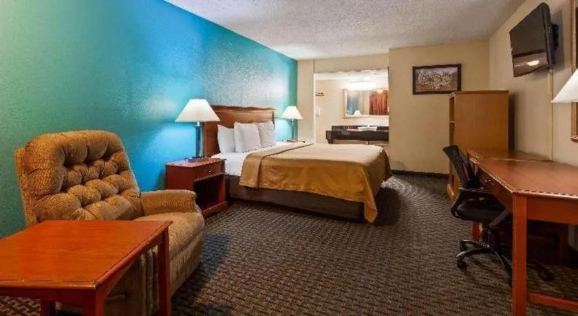 Bed in SureStay Hotel