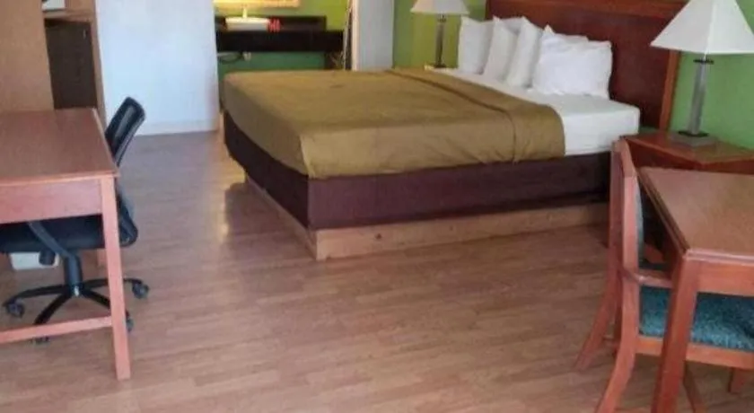 Bed in SureStay Hotel