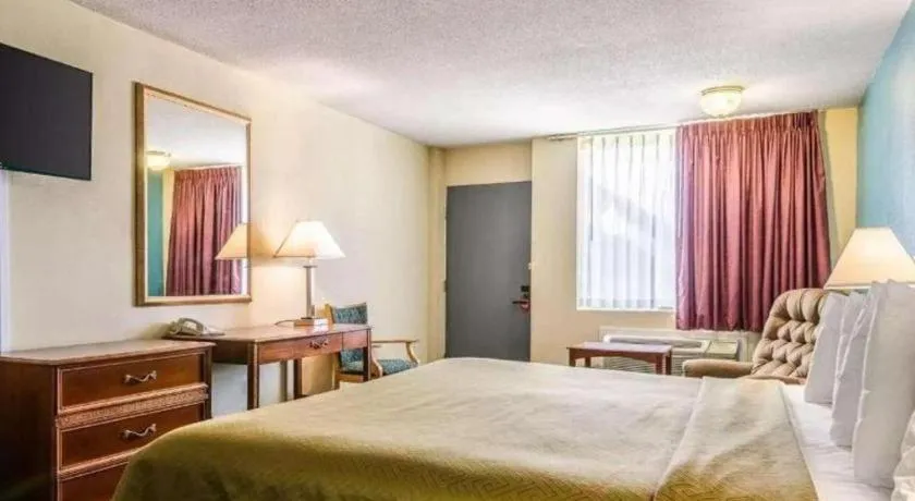 Bed in SureStay Hotel