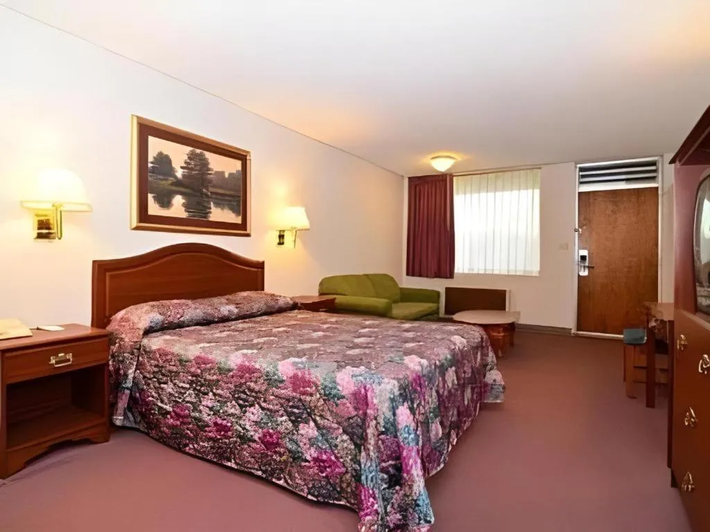 Bed in SureStay Hotel