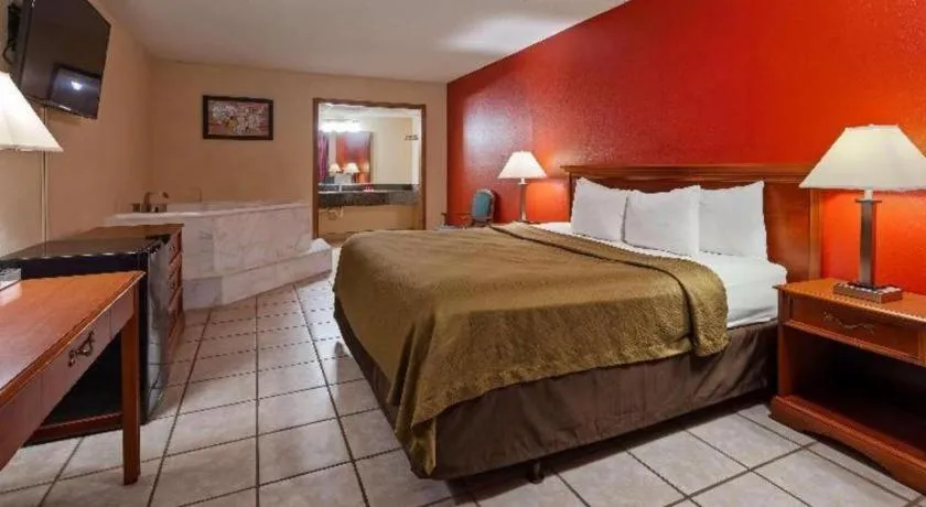 Bed in SureStay Hotel