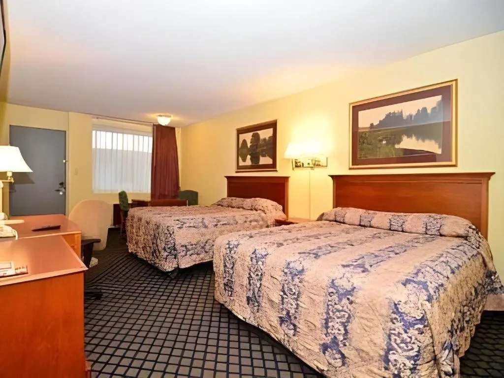 Bed in SureStay Hotel