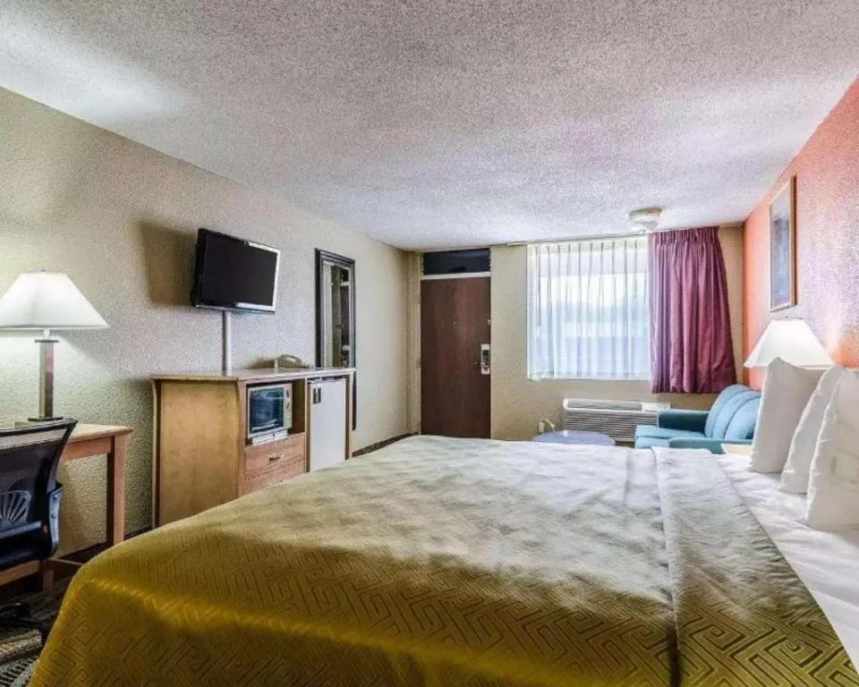 Bed in SureStay Hotel