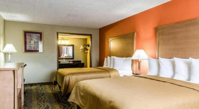 Bed in SureStay Hotel