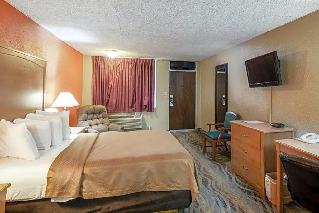 Bed in SureStay Hotel