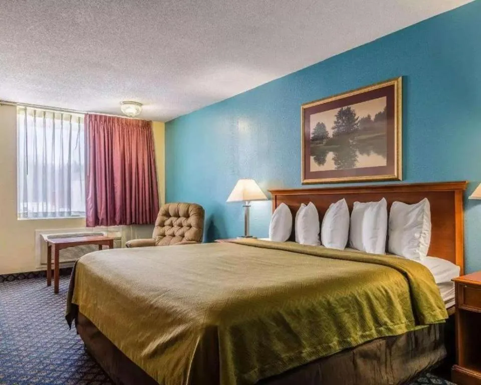 Bed in SureStay Hotel