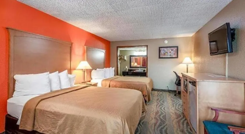 Bed in SureStay Hotel