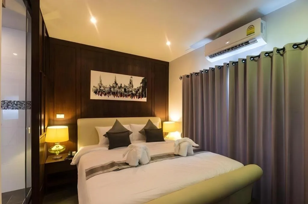 Bed in Vulcano Hotel at Nimman