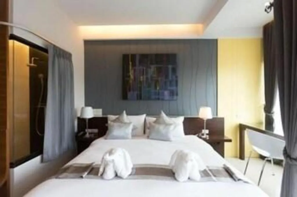 Bed in Vulcano Hotel at Nimman