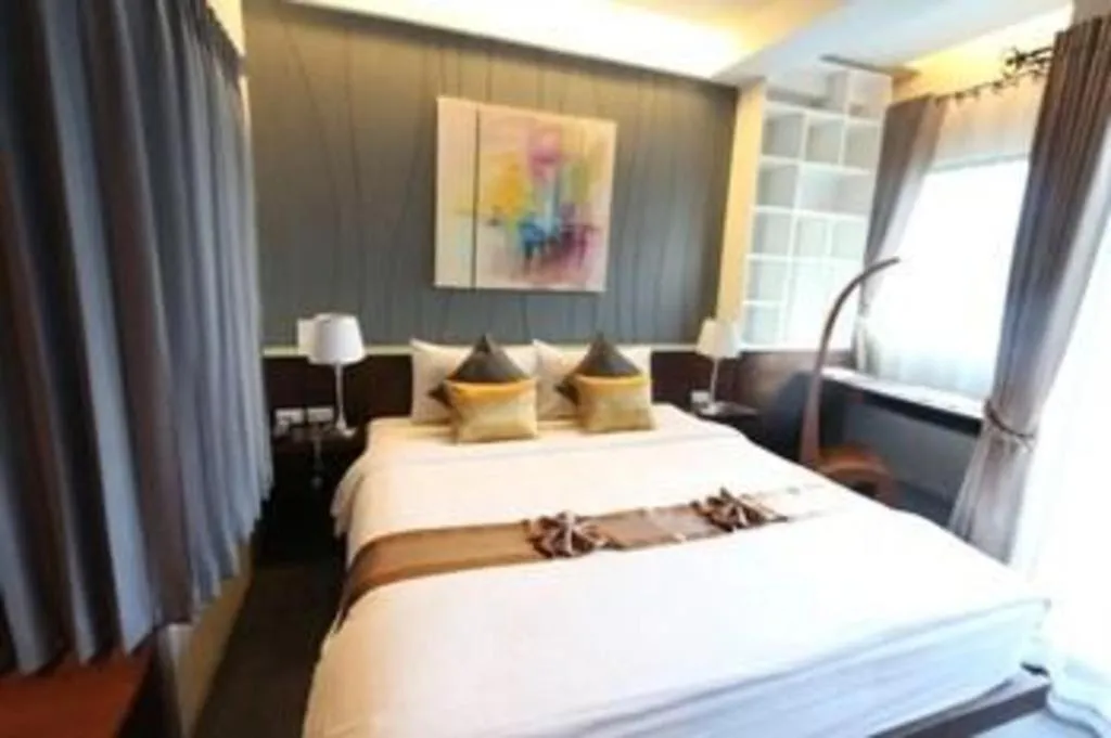 Bed in Vulcano Hotel at Nimman