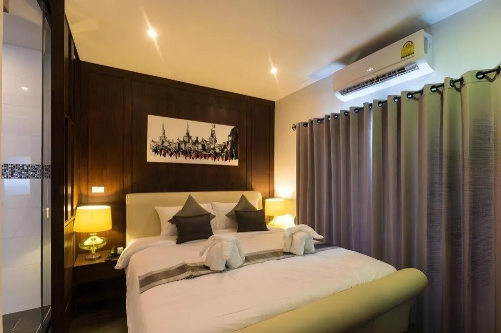 Bed in Vulcano Hotel at Nimman