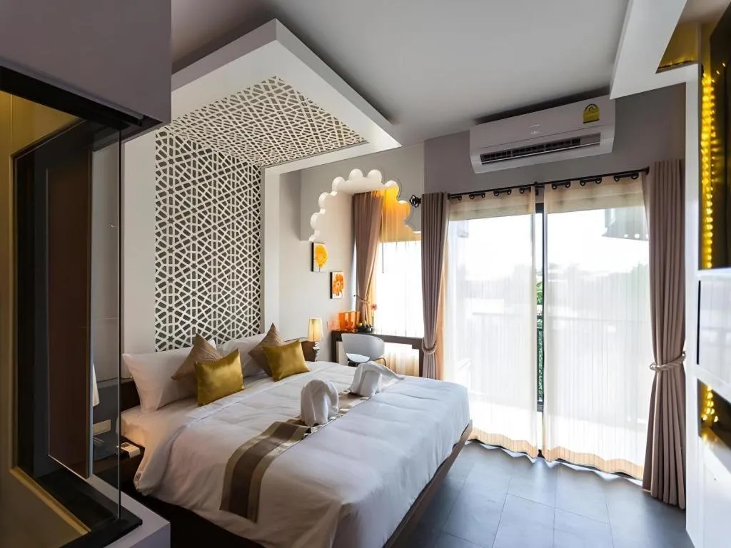 Bed in Vulcano Hotel at Nimman