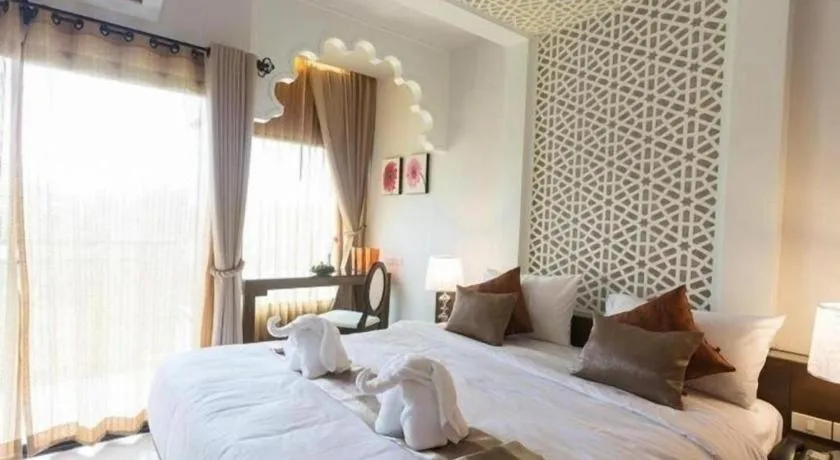 Bed in Vulcano Hotel at Nimman