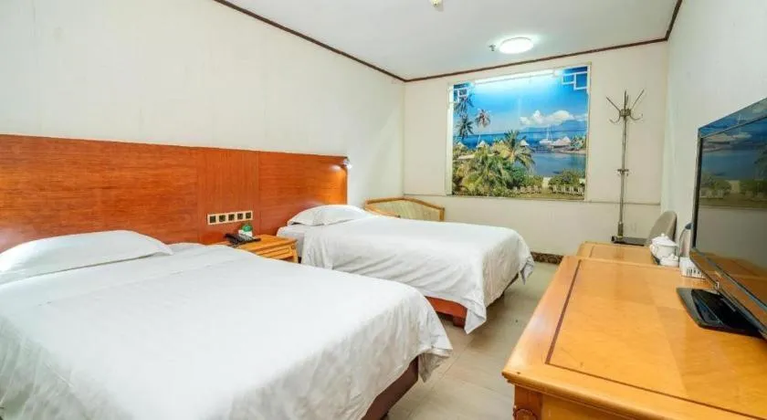 Bed in Nanfang Dasha Hotel