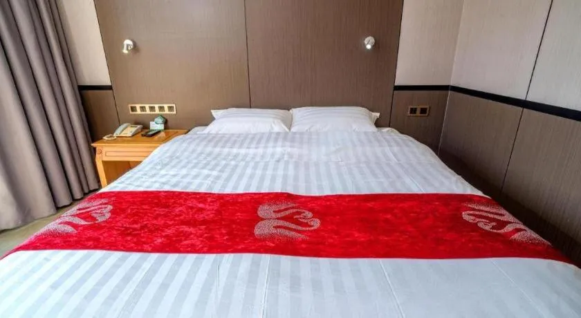 Bed in Nanfang Dasha Hotel
