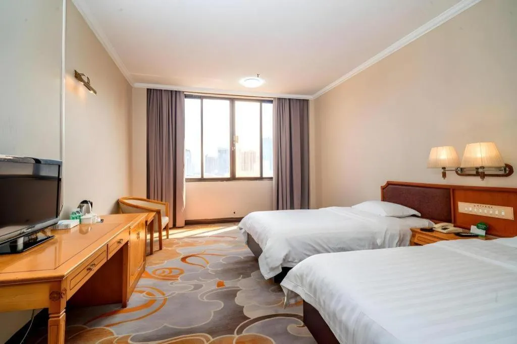 Bed in Nanfang Dasha Hotel