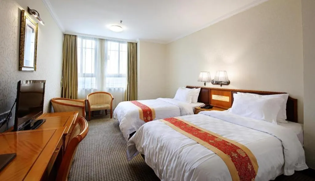 Bed in Nanfang Dasha Hotel