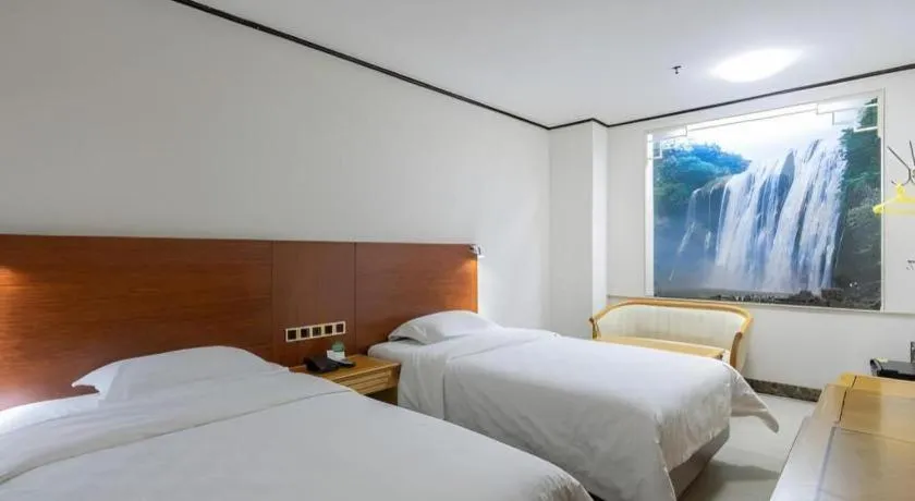 Bed in Nanfang Dasha Hotel