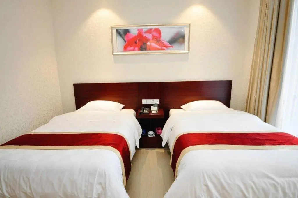 Bed in Nanfang Dasha Hotel
