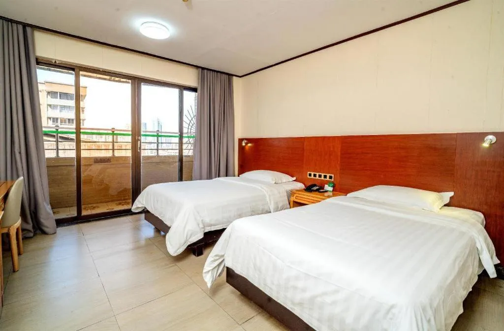 Bed in Nanfang Dasha Hotel