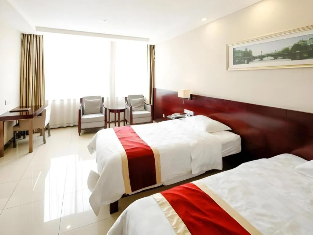 Bed in Nanfang Dasha Hotel