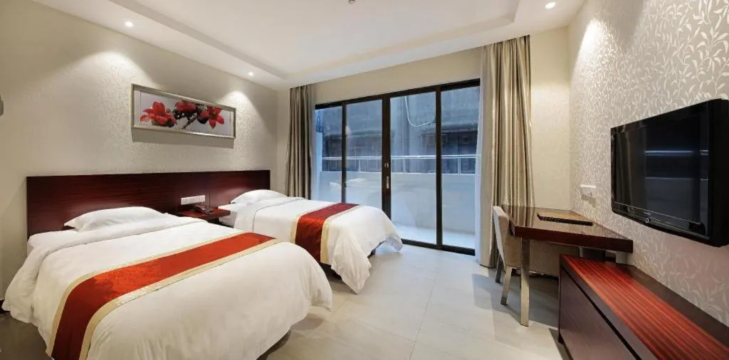 Bed in Nanfang Dasha Hotel