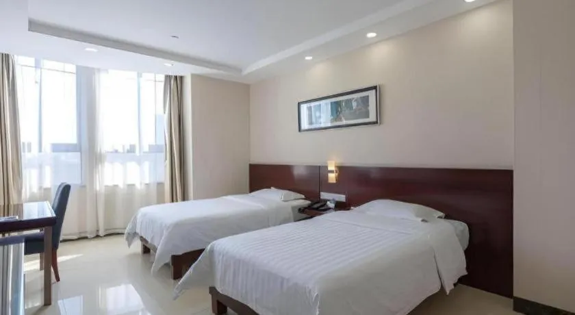 Bed in Nanfang Dasha Hotel