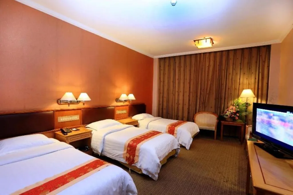 Bed in Nanfang Dasha Hotel