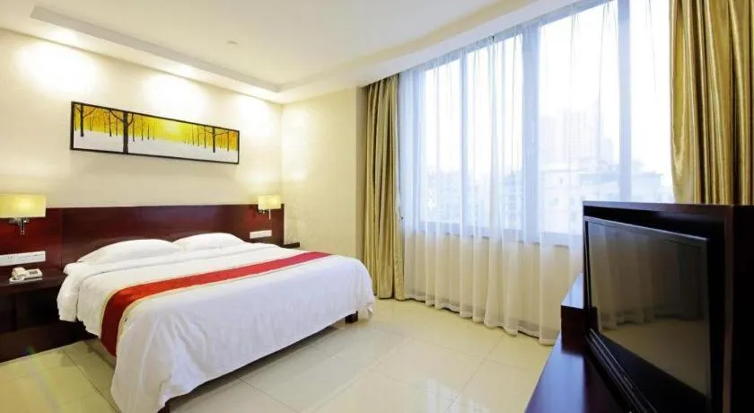 Bed in Nanfang Dasha Hotel